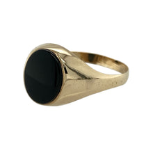 Load image into Gallery viewer, Classic and refined, this pre-owned 9ct yellow gold onyx signet ring offers timeless style with bold contrast—perfect for everyday wear or as a distinctive statement piece.

Design: The ring features a 10mm by 7mm oval onyx stone, set in a smooth bezel to highlight the rich black tone and clean lines of the signet shape.
Material: Made from 9-carat yellow gold, the polished finish adds warmth and enhances the sleek elegance of the onyx.

