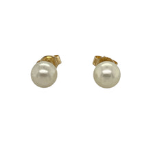 Load image into Gallery viewer, Timeless and elegant, these pre-owned 9ct yellow gold pearl stud earrings offer classic sophistication—perfect for everyday grace or special occasion style.

Design: Each earring features a 6mm round pearl set on a polished gold post, creating a simple yet refined silhouette.
Material: Made from 9-carat yellow gold, the smooth finish complements the soft lustre of the pearls for a warm, graceful look.

