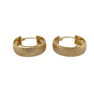 Chic and detailed, these pre-owned 9ct yellow gold textured pattern hoop creole earrings combine classic style with eye-catching texture—perfect for adding elegance to everyday wear.

Design: Each earring features a traditional creole hoop shape with a textured patterned finish, adding depth and a subtle sparkle to the polished surface.
Material: Made from 9-carat yellow gold, the warm tone is enhanced by the intricate detailing for a refined, timeless look.

