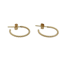 Load image into Gallery viewer, Delicate and stylish, these pre-owned 9ct yellow gold twisted half hoop earrings offer a subtle twist on a classic design—perfect for effortless everyday elegance.

Design: Each earring features a half hoop shape with a gentle twist, adding soft texture and visual interest to a timeless silhouette.
Material: Made from 9-carat yellow gold, the polished finish enhances the warm tone and highlights the flowing twist design.

