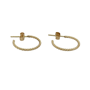 Delicate and stylish, these pre-owned 9ct yellow gold twisted half hoop earrings offer a subtle twist on a classic design—perfect for effortless everyday elegance.

Design: Each earring features a half hoop shape with a gentle twist, adding soft texture and visual interest to a timeless silhouette.
Material: Made from 9-carat yellow gold, the polished finish enhances the warm tone and highlights the flowing twist design.
