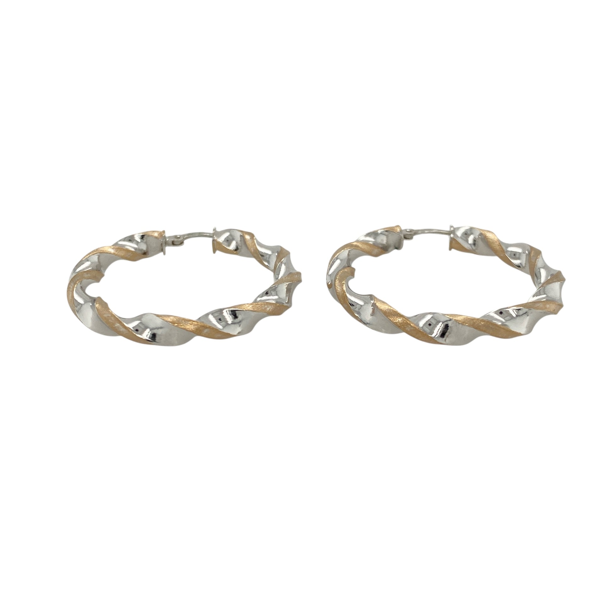 Elegant and eye-catching, these pre-owned 9ct yellow and white gold twisted hoop creole earrings feature a fluid two-tone design—perfect for versatile styling with a modern twist.

Design: Each earring showcases a classic hoop with an elegant twist, blending yellow and white gold in an intertwined design for subtle contrast and movement.
Material: Made from 9-carat yellow and white gold, the polished finish enhances the flowing curves and highlights the soft interplay of tones.
