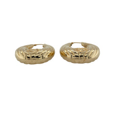 Load image into Gallery viewer, Striking and full of character, these pre-owned 9ct yellow gold large oval creole earrings feature intricate detailing and bold design—perfect for making a statement with cultural flair.

Design: Each earring showcases a large oval creole shape with a detailed patterned finish, featuring a raised face design reminiscent of a Native American figure, adding depth and individuality.
Material: Made from 9-carat yellow gold, the polished surface enhances the intricate textures and bold artistry of the design.

