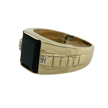 Load image into Gallery viewer, Bring bold contrast and sleek style to your jewellery collection with this pre-owned 9ct yellow gold signet ring, featuring a striking onyx centre and subtle diamond detail—perfect for confident everyday wear or a signature look.

Design: The ring showcases a 10mm by 9mm rectangular onyx stone at the centre, accented with a small diamond for a refined touch of sparkle against the dark backdrop.

