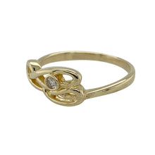Load image into Gallery viewer, Bring heritage design and subtle sparkle to your jewellery collection with this pre-owned 9ct yellow gold Clogau Celtic swirl ring, featuring elegant curves and diamond accents—perfect for everyday elegance with symbolic meaning.

Design: The ring showcases a flowing Celtic swirl motif, measuring 8mm high at the front, accented with diamonds to highlight the graceful lines and traditional influence.

