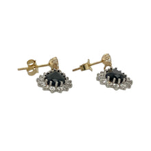 Load image into Gallery viewer, Bring graceful sparkle and classic colour to your jewellery collection with these pre-owned 9ct yellow gold teardrop cluster drop earrings, featuring rich sapphires and shimmering cubic zirconia—perfect for elegant occasions or refined everyday wear.

Design: Each earring features an 8mm by 5mm deep blue sapphire stone in a teardrop shape, surrounded by a cluster of cubic zirconia for added brilliance and contrast.

