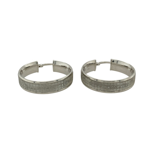 Bring shimmering elegance and versatile style to your jewellery collection with these pre-owned 9ct white gold sparkle hoop creole earrings—perfect for both everyday wear and special occasions.

Design: Each earring features a classic creole hoop shape with a sparkle-cut finish, catching the light beautifully for added brilliance.
Material: Made from 9-carat white gold, the polished surface and bright tone give a sleek, modern look with timeless appeal.
