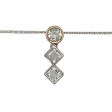 Load image into Gallery viewer, Bring regal elegance and sparkling detail to your jewellery collection with this pre-owned 925 silver Clogau Royalty Anniversary pendant necklace, detailed with 9ct rose gold and white topaz—perfect for marking special occasions in style.

Design: The pendant measures 2.2cm long and features an intricate Royalty-inspired design, accented with polished 9ct rose gold detailing and set with shimmering white topaz stones for a refined, luxurious finish.

