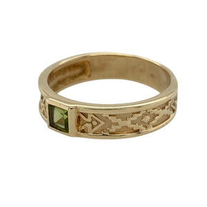 Bring vibrant colour and unique style to your collection with this pre-owned 9ct yellow gold peridot patterned band ring—perfect for adding a touch of individuality and warmth to any look.

Design: The ring features a 5mm wide band with an intricate patterned design, accented by a single peridot for a fresh pop of green.
Material: Made from 9-carat yellow gold, the polished finish enhances the warmth of the gold and the vivid tone of the gemstone.
