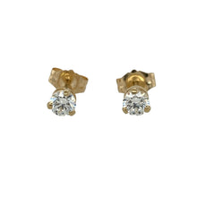 Load image into Gallery viewer, Bring classic sparkle and everyday elegance to your collection with these pre-owned 14ct yellow gold cubic zirconia stud earrings—perfect for adding a touch of brilliance to any outfit.

Design: Each earring features a single round cubic zirconia measuring approximately 4mm in diameter, offering a timeless and versatile look.
Material: Made from 14-carat yellow gold, the polished finish enhances the warmth of the gold and the sparkle of the stones.

