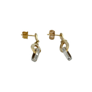 Bring contemporary elegance and a touch of sparkle to your collection with these pre-owned 9ct yellow and white gold two interlocking oval loop drop earrings—perfect for adding modern style to any look.

Design: Each earring features two interlocking oval loops, one in yellow gold and one in white gold, accented by a small cubic zirconia for subtle brilliance.
Material: Made from 9-carat yellow and white gold, the polished finish enhances the contrast between the metals and the sparkle of the stones.
