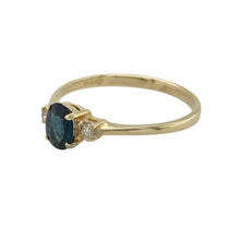 Load image into Gallery viewer, Bring timeless elegance and rich colour to your collection with this pre-owned 9ct yellow gold diamond and sapphire trilogy ring—perfect for special occasions or adding refined beauty to everyday wear.

Design: The ring features a 6mm by 4mm oval-cut sapphire at the centre, flanked by two sparkling diamonds for a balanced and sophisticated look.
Material: Made from 9-carat yellow gold, the polished finish complements the deep blue of the sapphire and enhances the brilliance of the diamonds.

