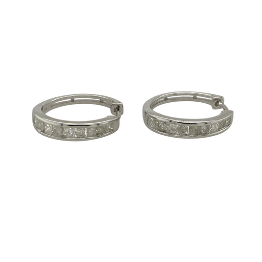 Bring modern elegance and subtle sparkle to your collection with these pre-owned 9ct white gold diamond hoop earrings—perfect for adding a touch of sophistication to both day and evening looks.

Design: Each hoop is accented with diamonds along the front, offering a refined shimmer that catches the light beautifully.
Material: Made from 9-carat white gold, the cool-toned finish enhances the brilliance of the diamonds and delivers a sleek, contemporary feel.
