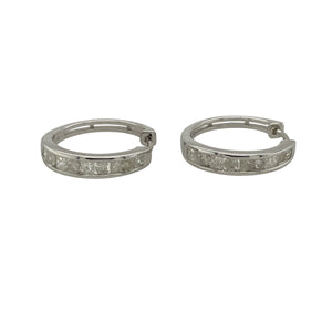 Bring modern elegance and subtle sparkle to your collection with these pre-owned 9ct white gold diamond hoop earrings—perfect for adding a touch of sophistication to both day and evening looks.

Design: Each hoop is accented with diamonds along the front, offering a refined shimmer that catches the light beautifully.
Material: Made from 9-carat white gold, the cool-toned finish enhances the brilliance of the diamonds and delivers a sleek, contemporary feel.
