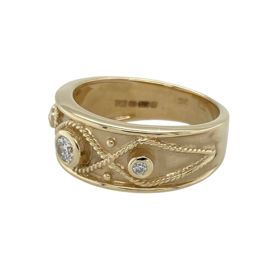 Bring classic sparkle and timeless design to your collection with this pre-owned 9ct yellow gold cubic zirconia trilogy band ring—perfect for adding elegant shine to everyday wear or marking a special occasion.

Design: The ring features a 7mm wide front with three cubic zirconia stones, including a 3mm round centre stone flanked by two smaller stones for a balanced and refined look.

