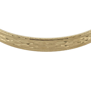 Bring classic elegance and practical design to your collection with this pre-owned 9ct yellow gold patterned expanding bangle—perfect for everyday wear or marking a special occasion.

Design: The bangle features a 7mm wide band adorned with an intricate pattern, offering both texture and timeless appeal.
Material: Made from 9-carat yellow gold, the polished finish enhances the warm tone and highlights the detailed design.
