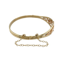 Load image into Gallery viewer, Bring symbolic elegance and timeless craftsmanship to your collection with this pre-owned 9ct yellow and rose gold Clogau Tree of Life bangle—perfect for marking special occasions or adding a meaningful touch to everyday wear.

Design: The front of the bangle measures 12mm high and features intricate rose gold Tree of Life detailing against a yellow gold background, symbolising growth, strength, and harmony.

