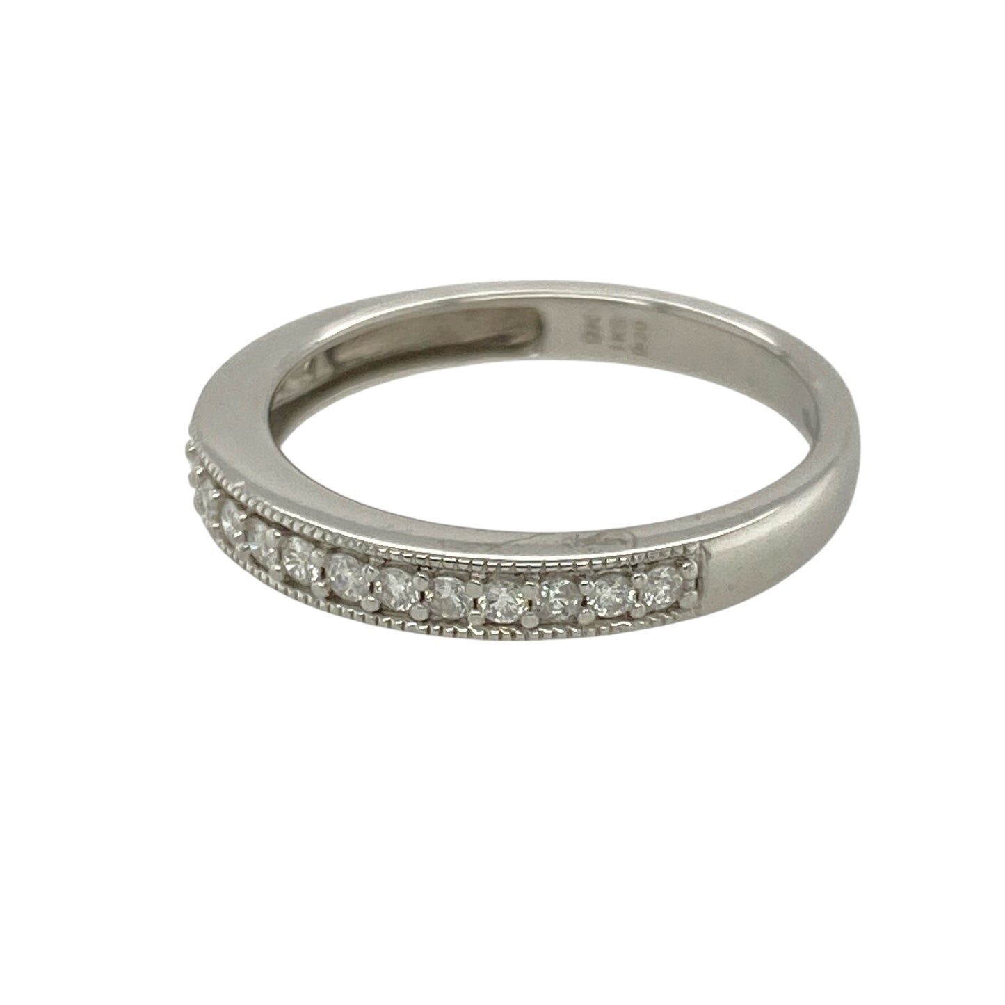 Bring delicate sparkle and refined detail to your collection with this pre-owned 9ct white gold diamond band ring—perfect for everyday elegance or pairing with other rings for a layered look.

Design: The ring features a 2mm wide front accented with diamonds and finished with a beaded edge for added texture and charm.
Material: Made from 9-carat white gold, the cool-toned polished finish enhances the brilliance of the diamonds.
