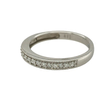 Load image into Gallery viewer, Bring delicate sparkle and refined detail to your collection with this pre-owned 9ct white gold diamond band ring—perfect for everyday elegance or pairing with other rings for a layered look.

Design: The ring features a 2mm wide front accented with diamonds and finished with a beaded edge for added texture and charm.
Material: Made from 9-carat white gold, the cool-toned polished finish enhances the brilliance of the diamonds.

