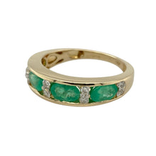 Load image into Gallery viewer, Bring rich colour and classic elegance to your collection with this pre-owned 14ct yellow gold diamond and emerald band ring—perfect for adding timeless beauty to both everyday wear and special occasions.

Design: The 5mm wide front is set with 4mm oval emerald stones, interspersed with sparkling diamonds for a balanced and refined look.
Material: Made from 14-carat yellow gold, the polished finish enhances the vivid green of the emeralds and the brilliance of the diamonds.

