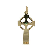 Load image into Gallery viewer, Bring symbolic beauty and intricate detail to your collection with this pre-owned 9ct yellow gold green stone Celtic patterned cross pendant—perfect for those who appreciate heritage-inspired jewellery.

Design: The pendant features a traditional cross shape adorned with detailed Celtic patterns and a 2mm emerald-coloured green stone at the centre for a vibrant focal point.
Material: Made from 9-carat yellow gold, the polished finish enhances the warm tone and highlights the intricate engraving.

