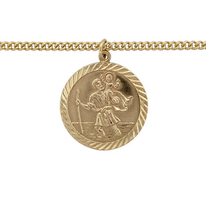 Bring meaningful style and timeless craftsmanship to your collection with this pre-owned 9ct yellow gold St Christopher pendant on a curb chain—perfect as a protective talisman or a thoughtful gift.

Design: The pendant features a detailed depiction of St Christopher in a classic round form, measuring 3.1cm in length including the bail.
Material: Made from 9-carat yellow gold, the polished finish enhances the warm tone and brings out the fine detailing.
