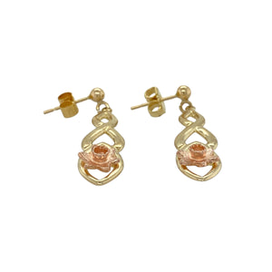 Bring floral beauty and heritage style to your collection with these pre-owned 9ct yellow and rose gold Clogau daffodil Celtic drop earrings—perfect for adding elegance with a touch of Welsh tradition.

Design: Each earring features an intricate Celtic-inspired drop design adorned with a detailed daffodil motif in warm rose gold.
Material: Made from 9-carat yellow and rose gold, the polished finish enhances the dual-tone contrast and fine detailing.
