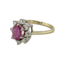 Load image into Gallery viewer, Bring rich colour and elegant sparkle to your collection with this pre-owned 9ct yellow gold diamond and ruby cluster ring—perfect for adding a timeless touch to any jewellery wardrobe.

Design: The ring features a 6mm by 4mm oval ruby at the centre, surrounded by a cluster of diamonds for a classic and eye-catching look.
Material: Made from 9-carat yellow gold, the polished finish enhances the deep red hue of the ruby and the brilliance of the diamonds.

