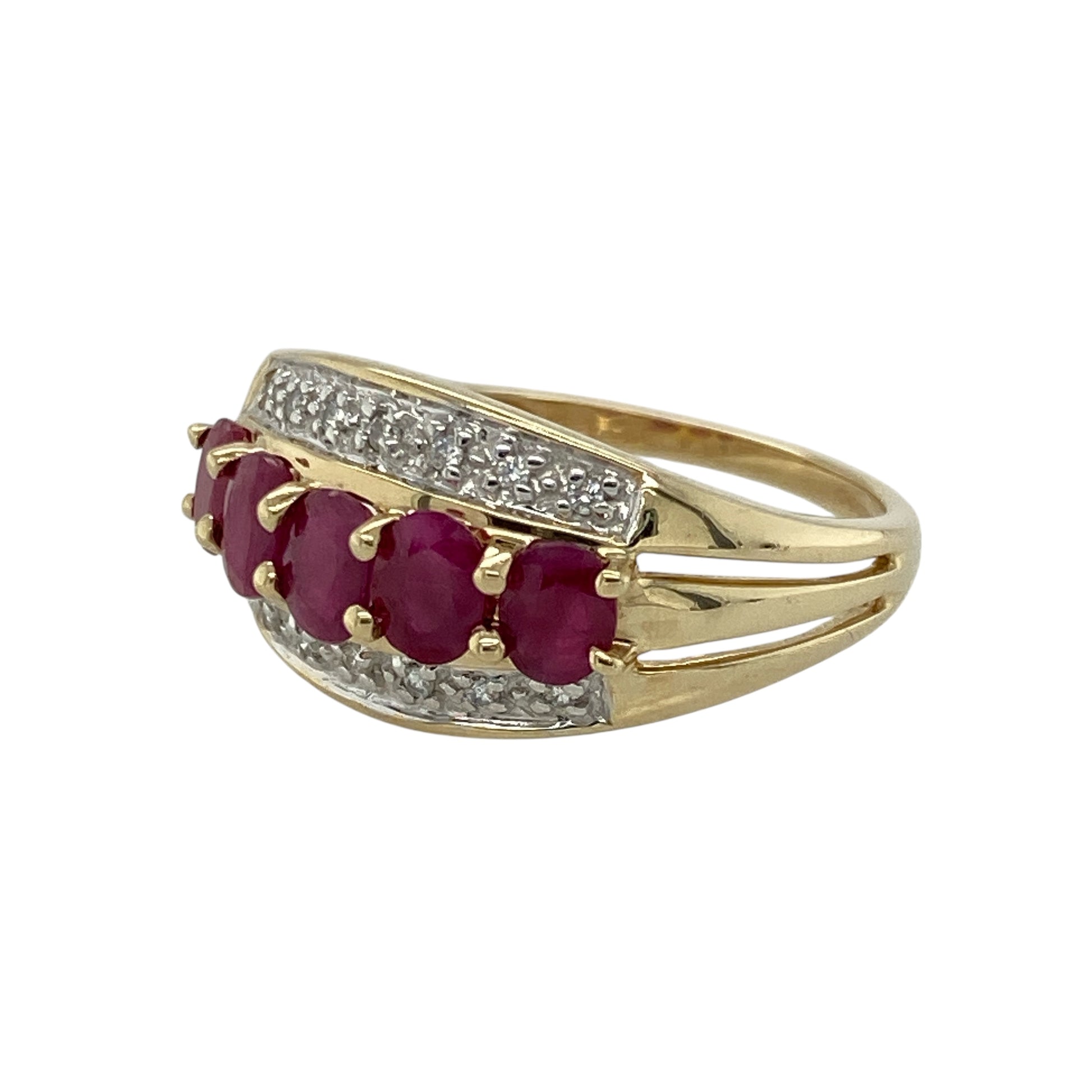 Bring vibrant colour and refined sparkle to your collection with this pre-owned 9ct yellow gold diamond and ruby band ring—perfect for adding elegance to everyday wear or marking a special occasion.

Design: The ring features a 10mm wide front set with five oval rubies, each measuring 4mm by 3mm, interspersed with diamonds for a balanced and eye-catching look.
Material: Made from 9-carat yellow gold, the polished finish enhances the deep red of the rubies and the brilliance of the diamonds.
