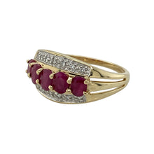 Load image into Gallery viewer, Bring vibrant colour and refined sparkle to your collection with this pre-owned 9ct yellow gold diamond and ruby band ring—perfect for adding elegance to everyday wear or marking a special occasion.

Design: The ring features a 10mm wide front set with five oval rubies, each measuring 4mm by 3mm, interspersed with diamonds for a balanced and eye-catching look.
Material: Made from 9-carat yellow gold, the polished finish enhances the deep red of the rubies and the brilliance of the diamonds.

