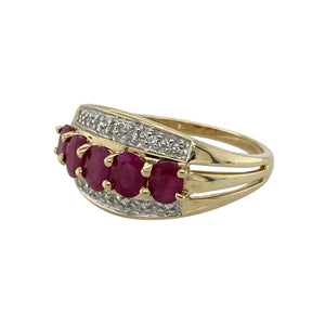 Bring vibrant colour and refined sparkle to your collection with this pre-owned 9ct yellow gold diamond and ruby band ring—perfect for adding elegance to everyday wear or marking a special occasion.

Design: The ring features a 10mm wide front set with five oval rubies, each measuring 4mm by 3mm, interspersed with diamonds for a balanced and eye-catching look.
Material: Made from 9-carat yellow gold, the polished finish enhances the deep red of the rubies and the brilliance of the diamonds.
