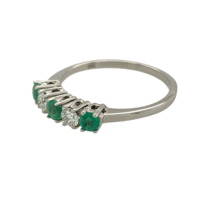 Bring fresh colour and refined sparkle to your collection with this pre-owned 9ct white gold diamond and emerald band ring—perfect for adding elegance to both everyday wear and special occasions.

Design: The band features three emerald stones, each measuring 3mm in diameter, interspersed with diamonds for a balanced and eye-catching look.
Material: Made from 9-carat white gold, the polished finish enhances the brilliance of the diamonds and the vivid green of the emeralds.
