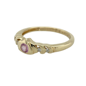 Bring feminine colour and refined sparkle to your collection with this pre-owned 9ct yellow gold diamond and pink sapphire ring—perfect for adding a delicate yet distinctive touch to any look.

Design: The ring features a 3mm round pink sapphire at the centre, accented by diamonds for added brilliance and contrast.
Material: Made from 9-carat yellow gold, the polished finish enhances the warm tone and complements the vibrant pink of the sapphire.
