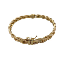 Load image into Gallery viewer, Bring textured style and golden elegance to your collection with this pre-owned 9ct yellow gold twisted plait hinged bangle—a distinctive piece with timeless appeal.

Design: The bangle features a twisted plait design with a hinged opening, combining intricate detail with everyday practicality.
Material: Made from 9-carat yellow gold, the polished finish enhances the plaited pattern and adds classic charm.

