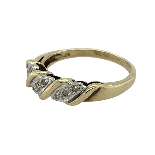Bring elegant contrast and subtle sparkle to your collection with this pre-owned 9ct yellow and white gold diamond twist band ring—a refined design with timeless appeal.

Design: The ring features an interwoven twist of yellow and white gold across the front of the band, accented with diamond detailing for added brilliance. The front of the band measures 5mm wide, giving it a graceful presence.
