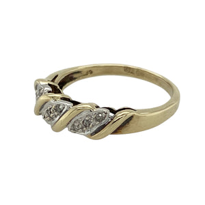 Bring elegant contrast and subtle sparkle to your collection with this pre-owned 9ct yellow and white gold diamond twist band ring—a refined design with timeless appeal.

Design: The ring features an interwoven twist of yellow and white gold across the front of the band, accented with diamond detailing for added brilliance. The front of the band measures 5mm wide, giving it a graceful presence.
