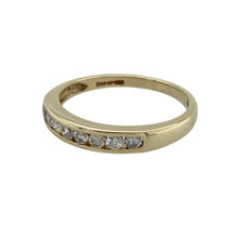 Load image into Gallery viewer, Bring timeless sparkle and golden elegance to your collection with this pre-owned 9ct yellow gold diamond band ring—a refined design perfect for everyday wear or special occasions.

Design: The ring features a 3mm wide band set with 0.25ct of diamond content across the front, offering brilliance and subtle sophistication.
Material: Made from 9-carat yellow gold, the polished finish enhances the classic style and complements the sparkle of the diamonds.

