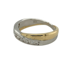 Load image into Gallery viewer, Bring elegant contrast and timeless sparkle to your collection with this pre-owned 18ct yellow and white gold diamond crossover band ring—a refined design with lasting sophistication.

Design: The ring features a 4mm wide crossover band in contrasting yellow and white gold, set with approximately 0.50ct of diamonds for a brilliant finish.
Material: Made from 18-carat yellow and white gold, the polished surfaces enhance the two-tone design and highlight the sparkle of the diamonds.

