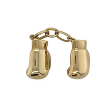 Load image into Gallery viewer, Bring bold character and sporting spirit to your collection with this pre-owned 9ct yellow gold boxing gloves pendant—a distinctive design with unique charm.

Design: The pendant features two detailed boxing gloves joined together by a small chain, creating a dynamic and symbolic piece.
Material: Made from 9-carat yellow gold, the polished finish highlights the glove details and adds timeless appeal.


