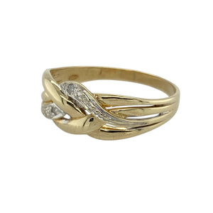 Bring elegant contrast and sparkling detail to your collection with this pre-owned 9ct yellow and white gold diamond swirl knot ring—a graceful design with timeless appeal.

Design: The ring features an 8mm wide swirl knot design accented with diamonds, creating a flowing shape with refined brilliance.
Material: Made from 9-carat yellow and white gold, the polished finish enhances the two-tone contrast and the sparkle of the diamonds.
