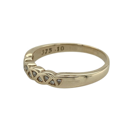 Bring timeless sparkle and golden elegance to your collection with this pre-owned 9ct yellow gold diamond band ring—a refined piece perfect for everyday wear or special occasions.

Design: The ring features a 3mm wide band accented with diamonds across the front, offering brilliance and subtle sophistication.
Material: Made from 9-carat yellow gold, the polished finish enhances the classic style and complements the sparkle of the diamonds.
