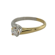 Load image into Gallery viewer, Bring refined elegance and timeless sparkle to your collection with this pre-owned 18ct yellow and white gold diamond solitaire twist ring—a graceful design with lasting sophistication.

Design: The ring showcases a brilliant-cut diamond of approximately 0.25ct, held in a stylish twist setting that enhances its brilliance.
Material: Made from 18-carat yellow and white gold, the polished finish highlights the two-tone contrast and the sparkle of the diamond.

