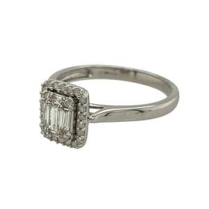 Bring refined sparkle and elegant design to your collection with this pre-owned 9ct white gold diamond halo cluster ring—a striking piece with timeless sophistication.

Design: The ring features a 10mm high rectangular halo cluster made up of straight baguette-cut and brilliant-cut diamonds, creating a bold and eye-catching arrangement.
Material: Made from 9-carat white gold, the polished finish enhances the brilliance of the diamonds and adds a sleek, modern touch.
