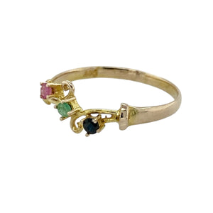 Bring vibrant colour and delicate charm to your collection with this pre-owned 9ct yellow gold band ring, accented with ruby, emerald, and sapphire for a timeless touch of elegance—perfect for subtle everyday wear or treasured keepsakes.

Design: The band features a trio of gemstones—ruby, emerald, and sapphire—arranged with classic scroll detailing that adds vintage-inspired character and refinement.
