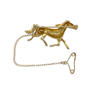 Bring character and timeless charm to your collection with this pre-owned 9ct yellow gold horse brooch, capturing the elegance and movement of a galloping horse—perfect for equestrian lovers or vintage jewellery enthusiasts.

Design: The brooch depicts a horse in mid-gallop, full of energy and detail, creating a dynamic and eye-catching piece.
Material: Made from 9-carat yellow gold, the polished finish highlights the intricate detailing and gives the brooch a warm, classic glow.
