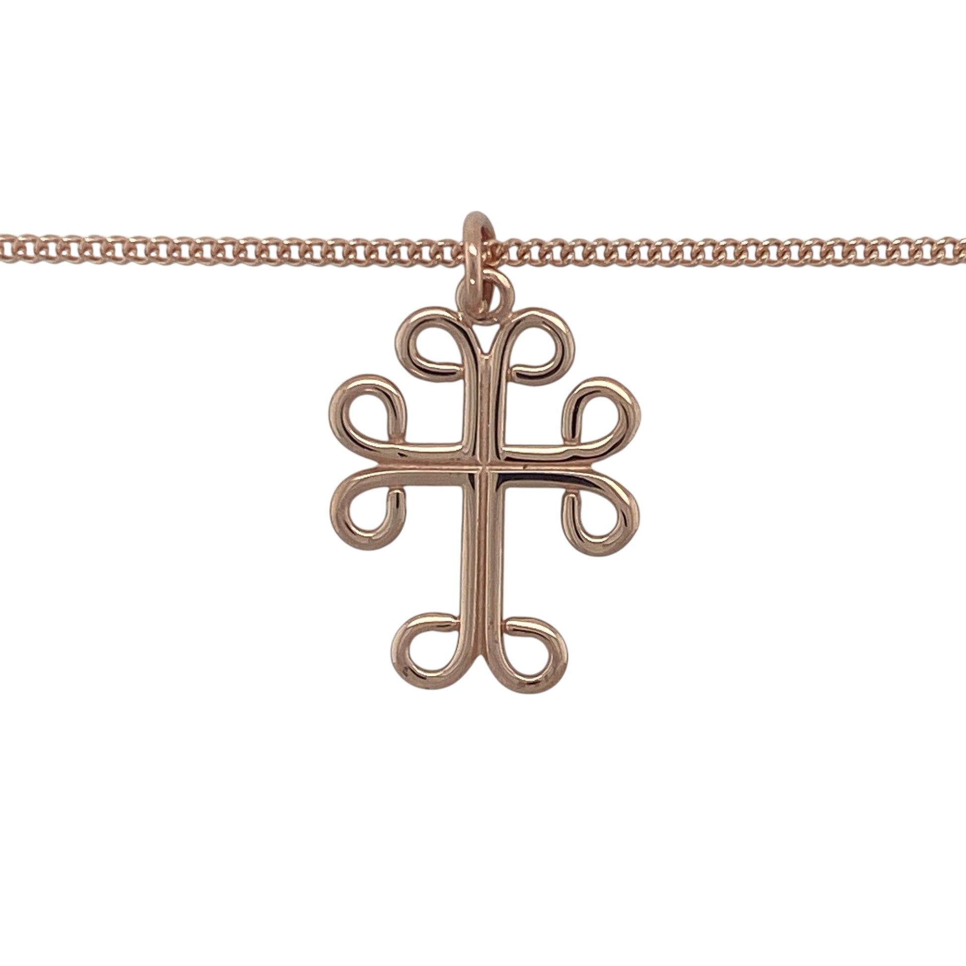 Bring heritage symbolism and timeless elegance to your collection with this pre-owned 9ct rose Welsh gold Celtic-style cross pendant necklace, a meaningful design with lasting beauty.

Design: The pendant measures 2.7cm long including the bail and features a traditional Celtic cross design with intricate detailing, suspended from an 18" curb chain.
Material: Made from 9-carat rose Welsh gold, the warm tone highlights the Celtic styling while celebrating the rarity and heritage of Welsh gold.
