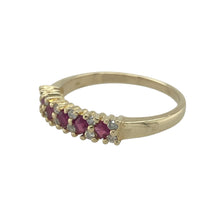 Load image into Gallery viewer, Bring rich colour and sparkling elegance to your collection with this pre-owned 9ct yellow gold diamond and ruby band ring—a refined design with timeless appeal.

Design: The ring features a 4mm wide band accented with alternating rubies and diamonds, creating a classic contrast of deep red and brilliant sparkle.
Material: Made from 9-carat yellow gold, the polished finish enhances the warmth of the gold and complements the gemstones.

