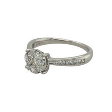 Load image into Gallery viewer, Bring timeless sparkle and refined style to your collection with this pre-owned 9ct white gold diamond illusion solitaire ring—a classic design with impressive brilliance.

Design: The ring features a central illusion-set cluster designed to create the look of a larger solitaire stone, with approximately 0.50ct of diamond content in total.
Material: Made from 9-carat white gold, the polished finish enhances the brilliance of the diamonds and adds modern appeal.
 
