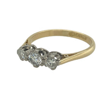 Load image into Gallery viewer, Bring timeless meaning and refined sparkle to your collection with this pre-owned 18ct yellow gold and platinum diamond trilogy ring—a classic design symbolising past, present, and future.

Design: The ring features a traditional three-stone layout with diamonds totalling approximately 0.40ct, offering balanced brilliance across the band.
Material: Made from 18-carat yellow gold with platinum settings, the polished finish enhances the contrast and the sparkle of the diamonds.

