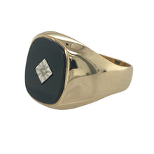 Load image into Gallery viewer, Bring bold contrast and refined detail to your collection with this pre-owned 9ct yellow gold diamond and onyx signet ring—a distinctive design with timeless appeal.

Design: The ring features a 13mm by 11mm rounded rectangular onyx stone at the centre, accented with a single small diamond for added brilliance.
Material: Made from 9-carat yellow gold, the polished finish enhances the deep black of the onyx and the sparkle of the diamond.

